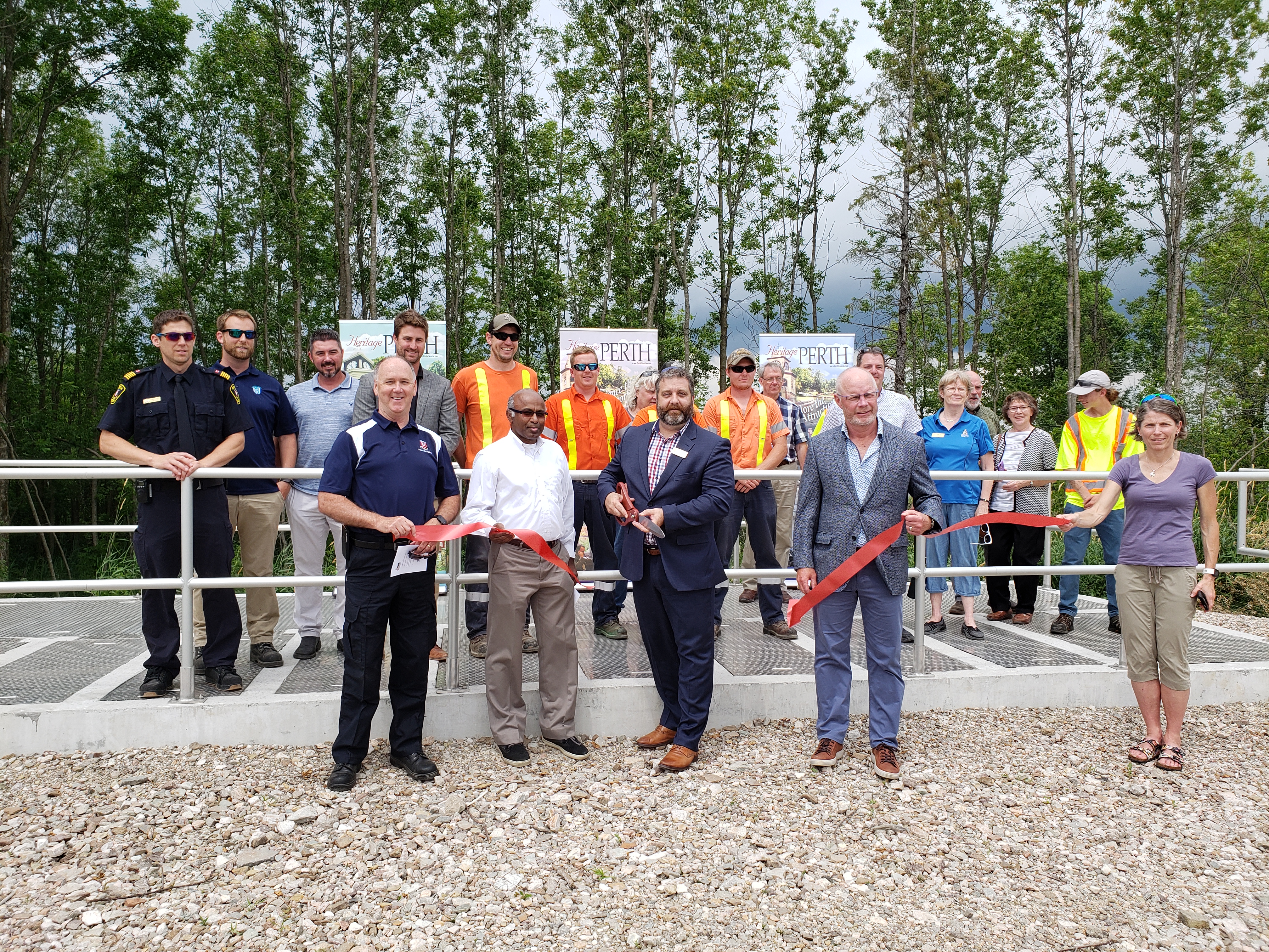Representatives from the city of Perth cutting the ribbon at a ceremony opening the new wastewater treatment system