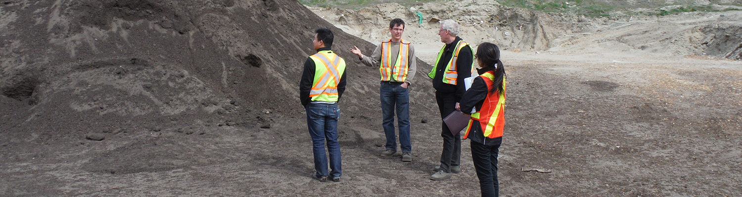 A team consults on a potential site for soil remediation