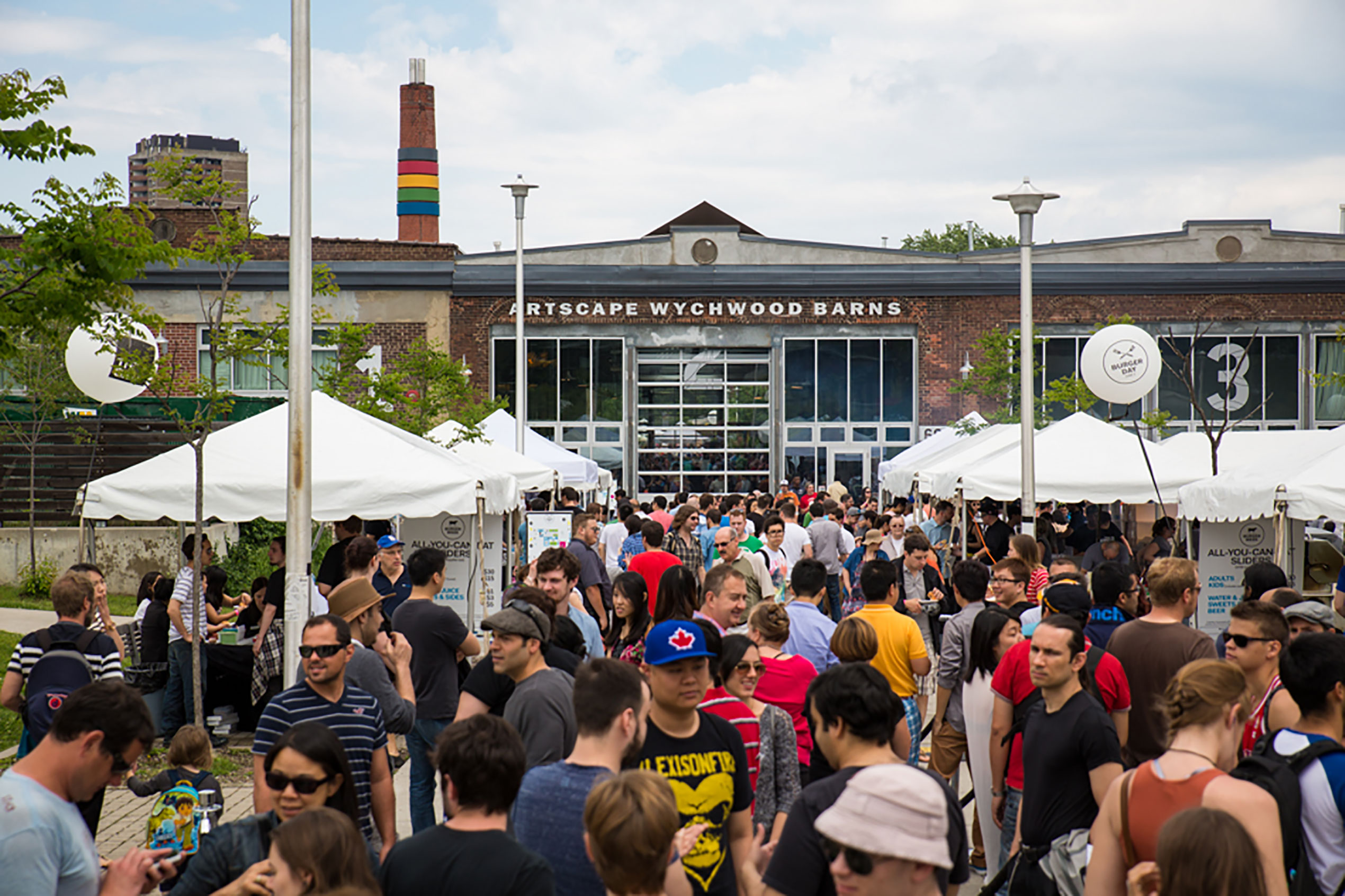 A crowd gathers at the opening of Artscape Wychwood Barns