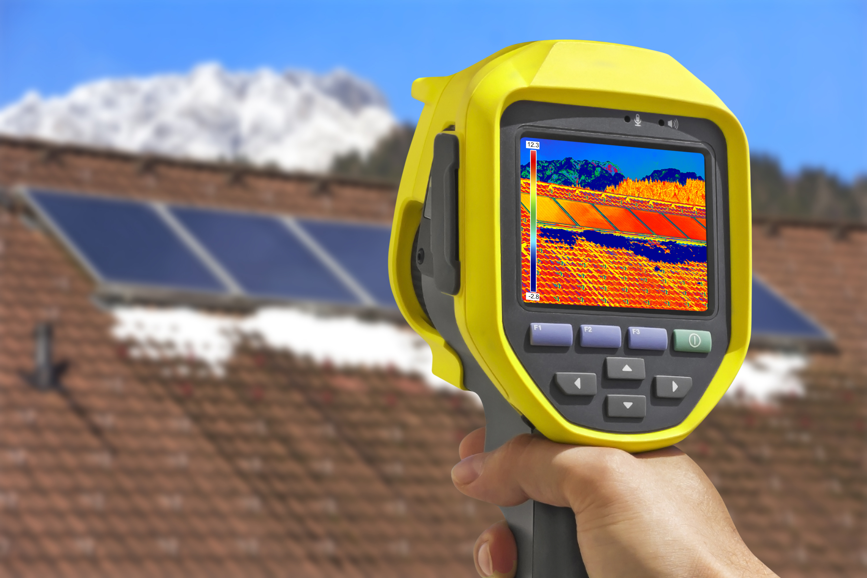 Thermal camera pointed at solar panels on a rooftop.