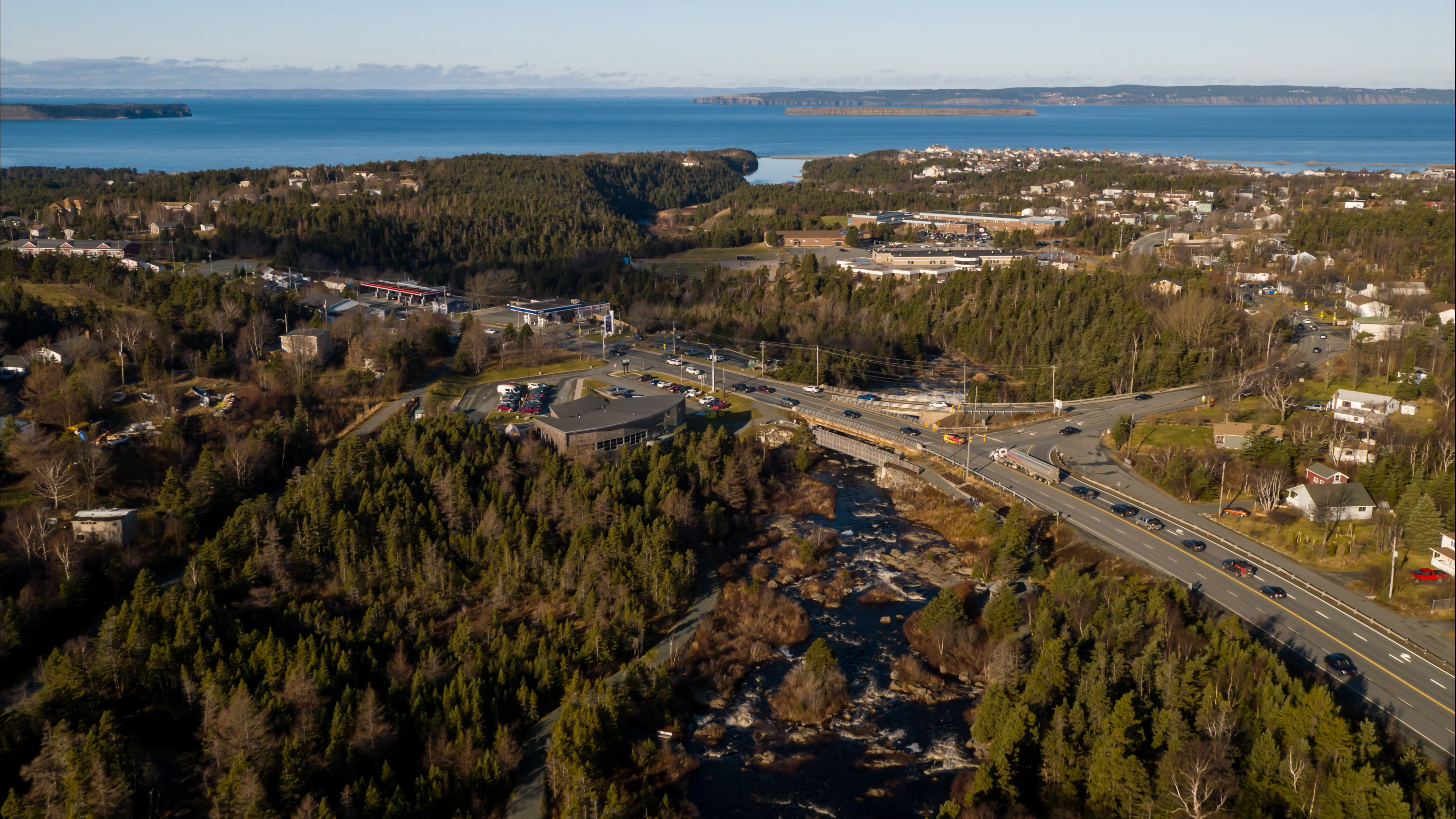 Aerial view of bridge infrastructure in Conception Bay South, with the ocean in the distance.