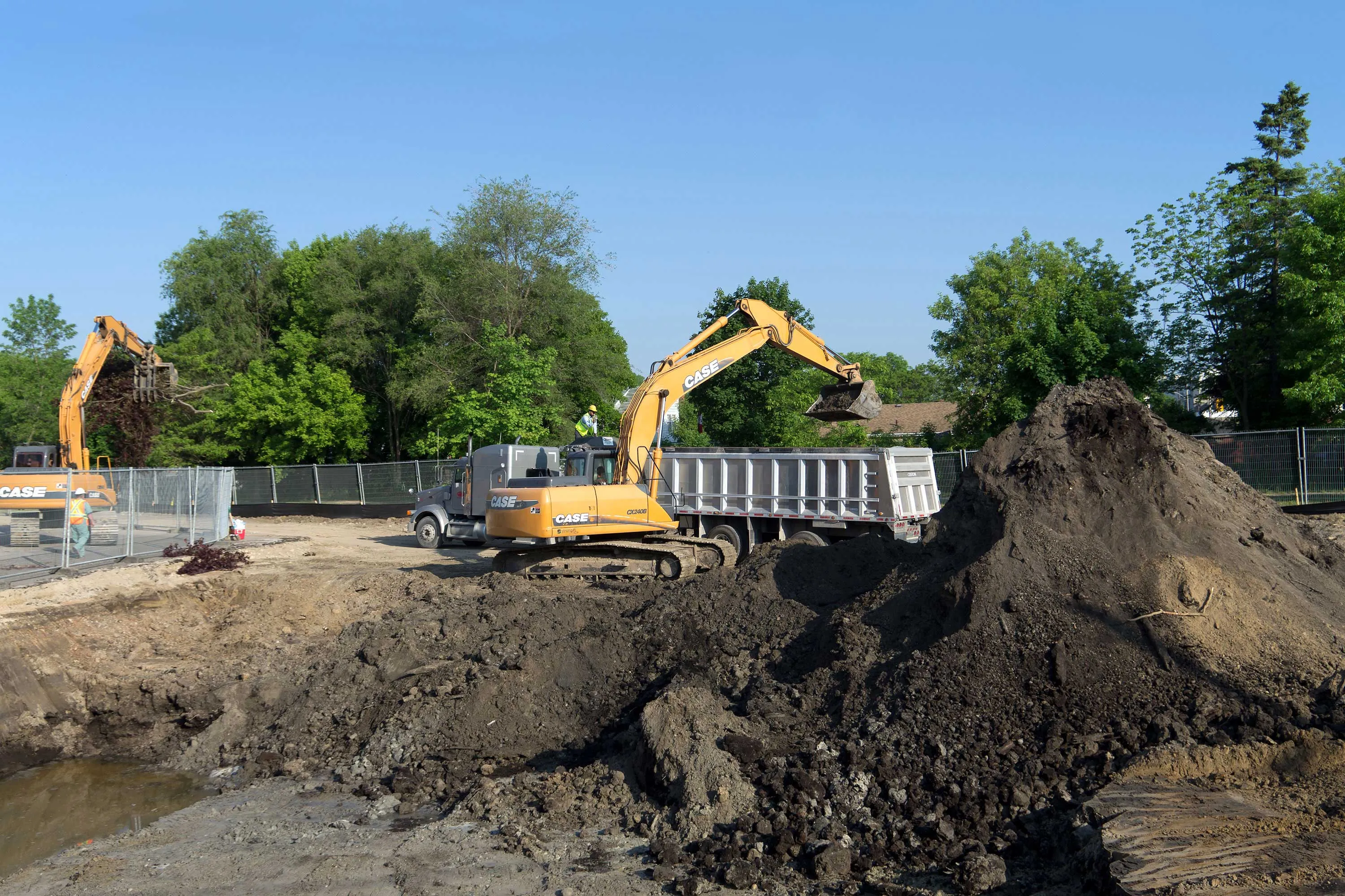 yellow backhoe on jobsite