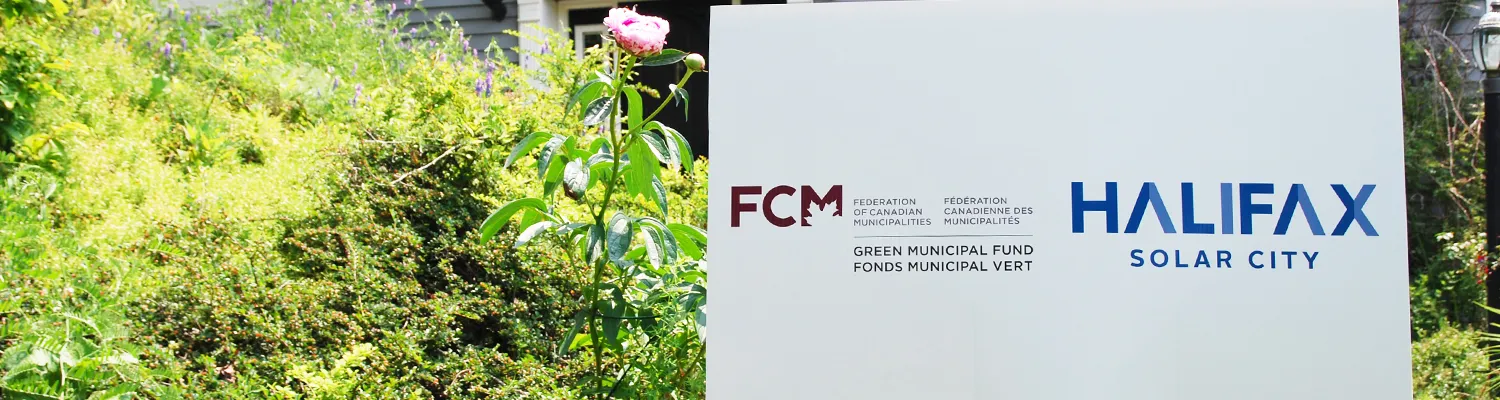 A sign bearing the logos of FCM and the Regional Municipality of Halifax sits outside a house