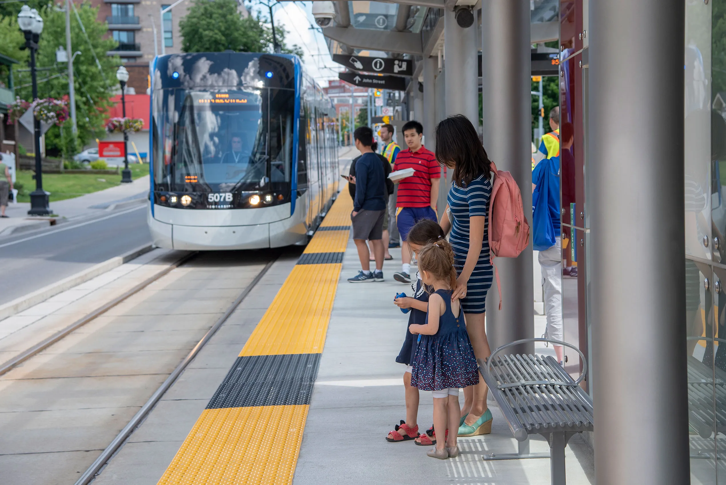 mother and children waiting for LRT