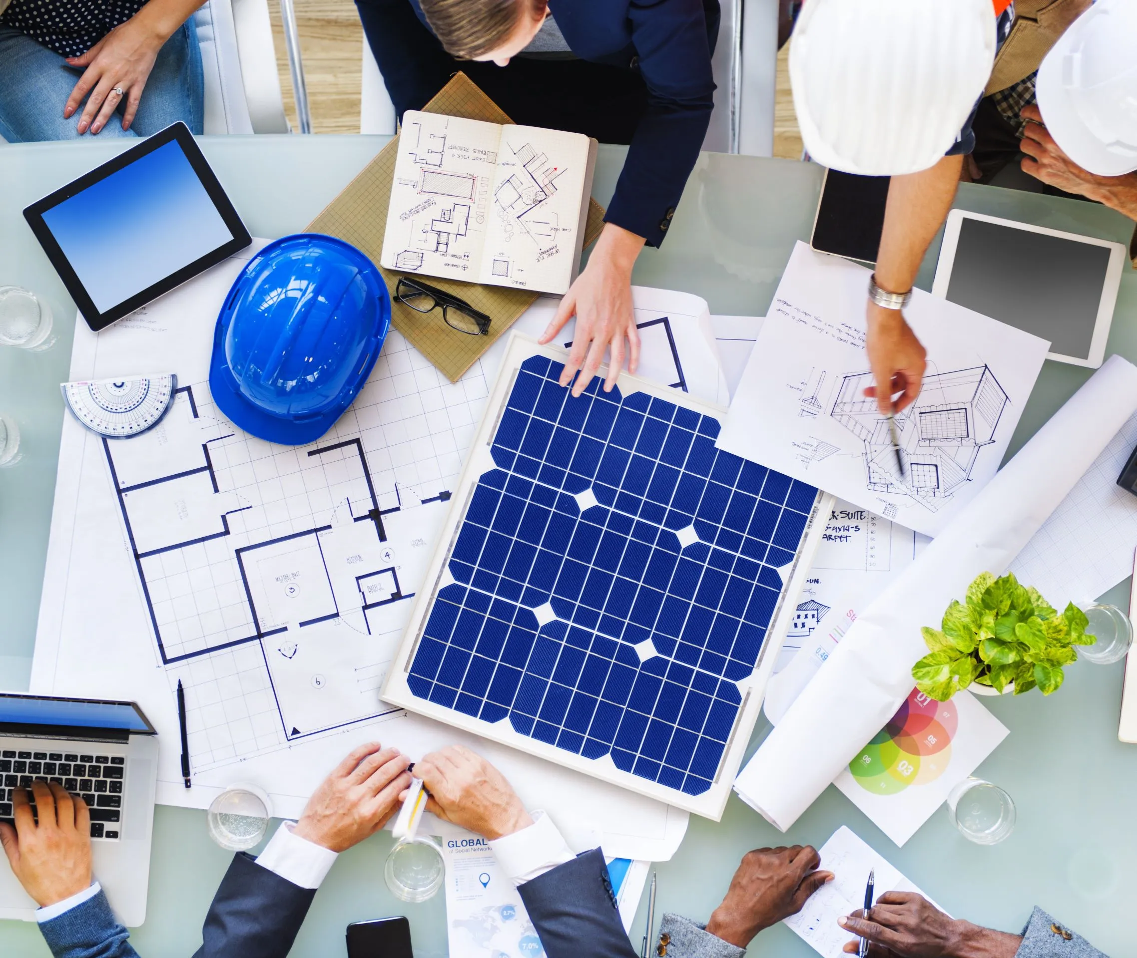 Engineers and architects around a table, planning a new project.