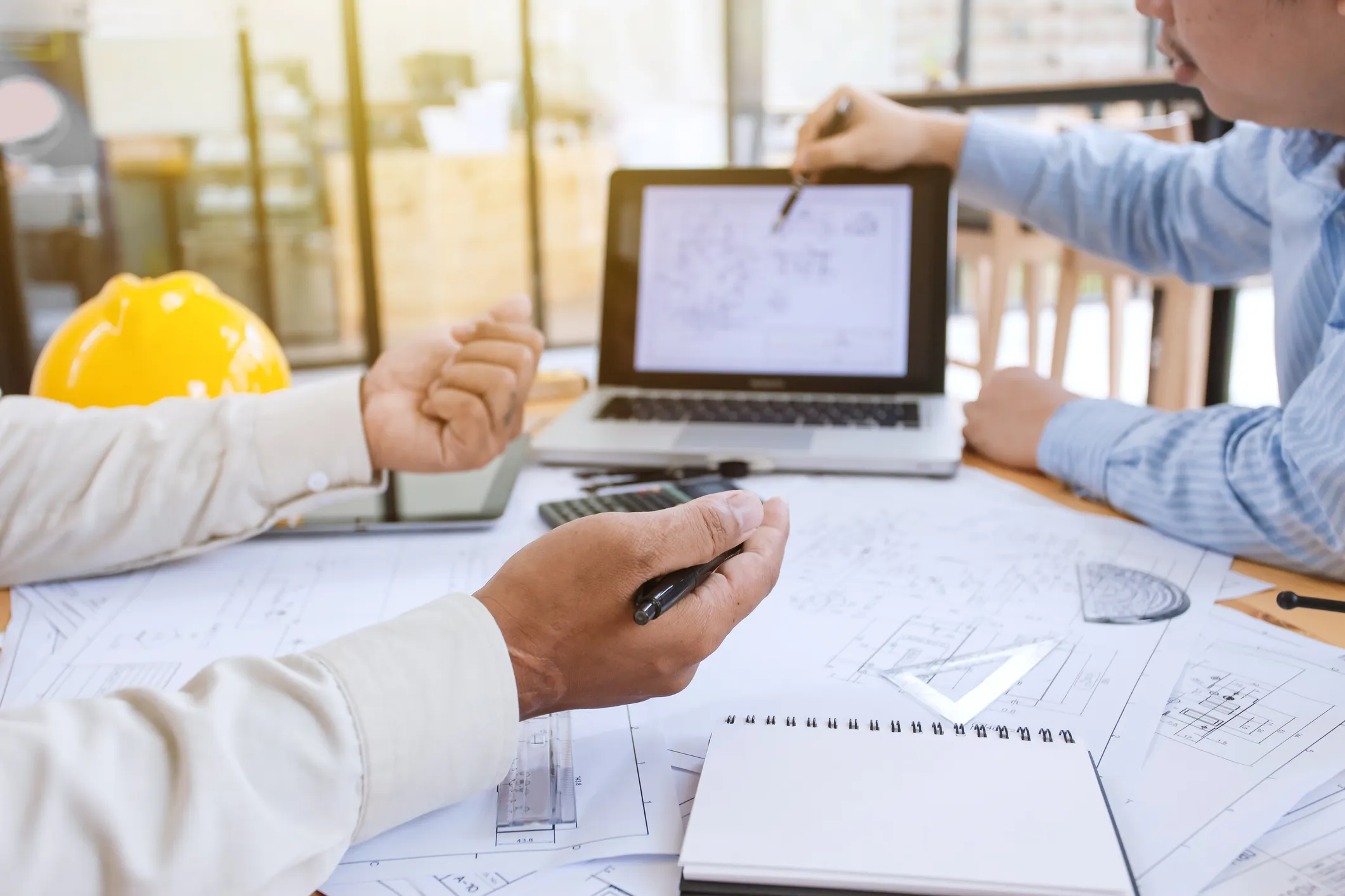 Engineer drawing blueprints.